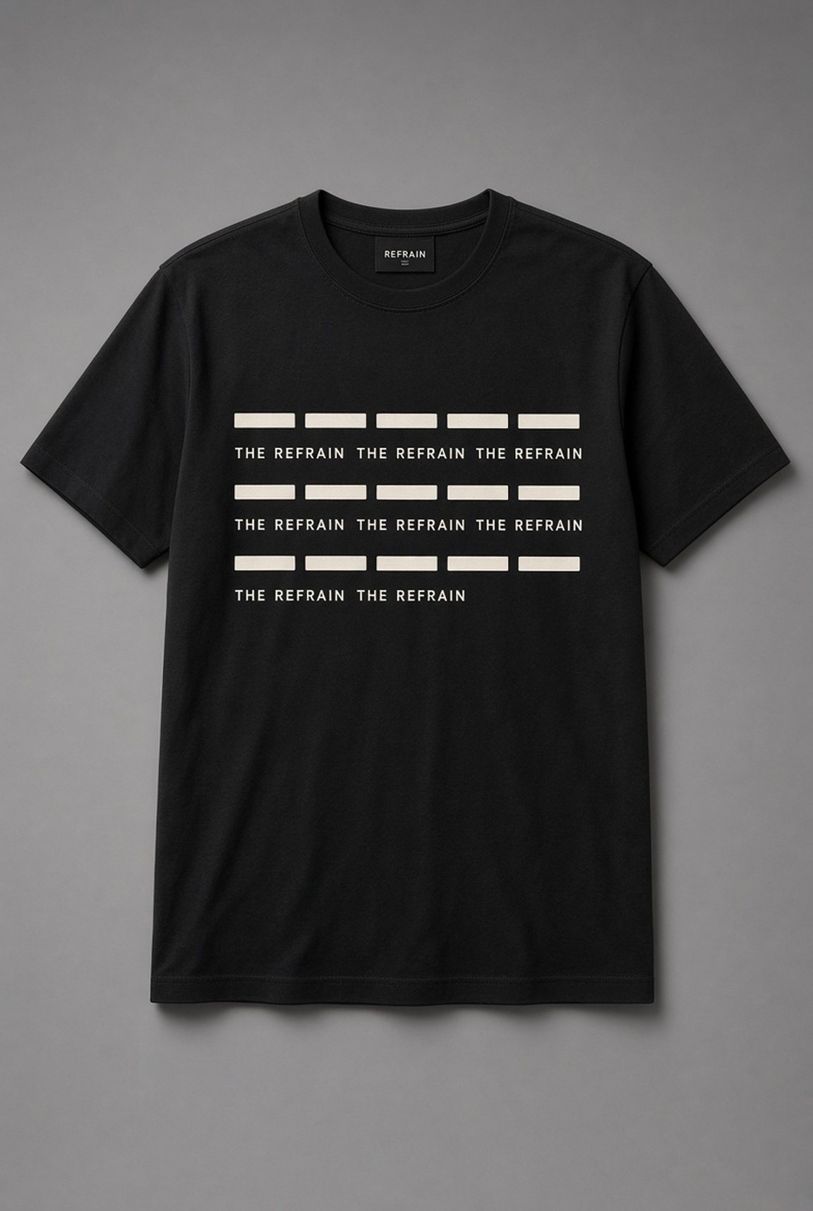 The Refrain Repeat Pattern unisex t-shirt in black with rows of bars with the words repeated